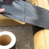 Post being wrapped with Post Tape