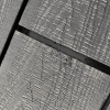 An image of composite boards being laid and the gap being covered by black decking tape.