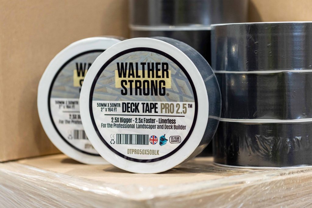 Two rolls of Decking Tape Decktape Pro 2.5x on boxes – UV stable, easy-to-tear, professional-grade protective tape