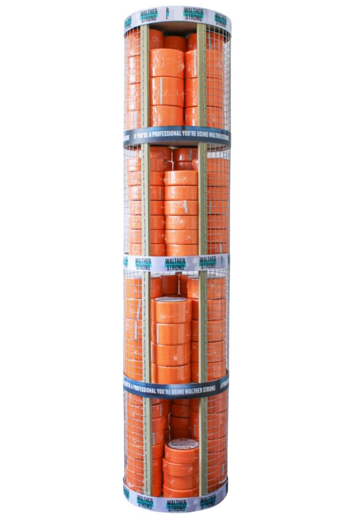 A point of sale of scrim with lots of rolls stacked in a birdcage.